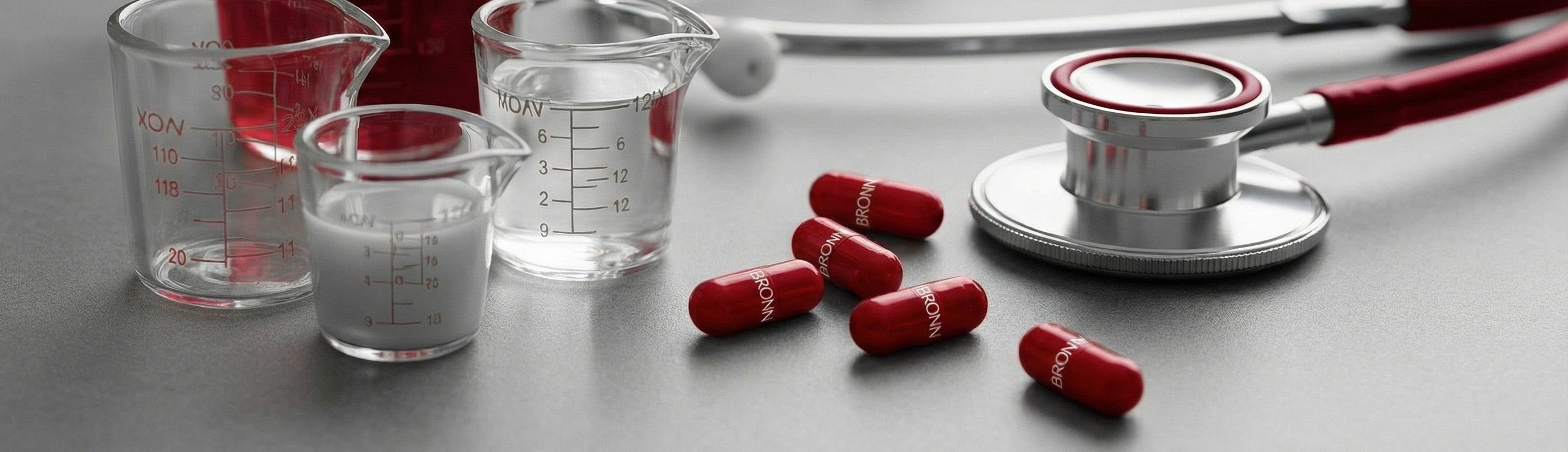 Sport shoes, towel, batteries, in-ears,  laptop, phone, make up on a grey background