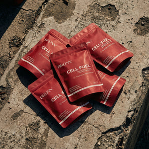 Red packets of Bronn Cell Fuel on a textured stone surface