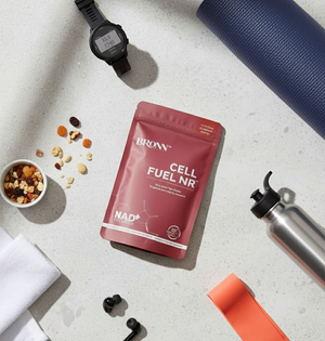 Bronn Cell Fuel NR package on a table with snacks, watch, and water bottle.