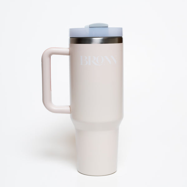 White travel mug with handle on a white background