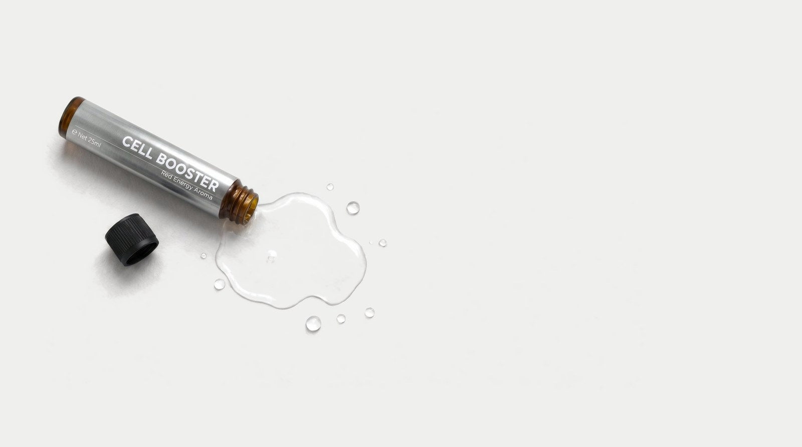 An opened CELL BOOSTER&trade; shot with a puddle of liquid